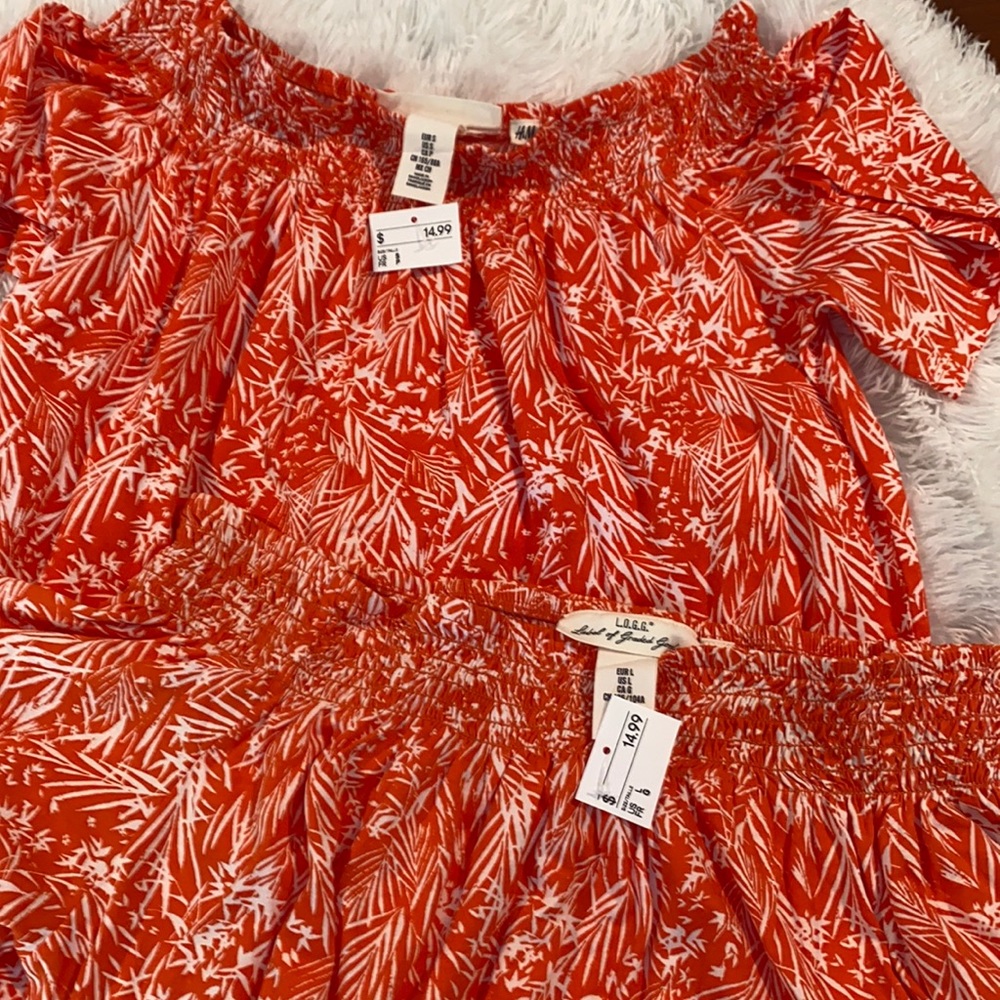 Bright orange top, with floral designs.